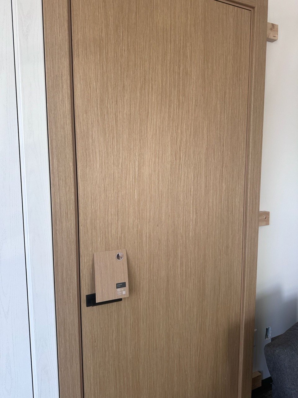 Natural oak wood veneer interior door, close-up of the vertical grain