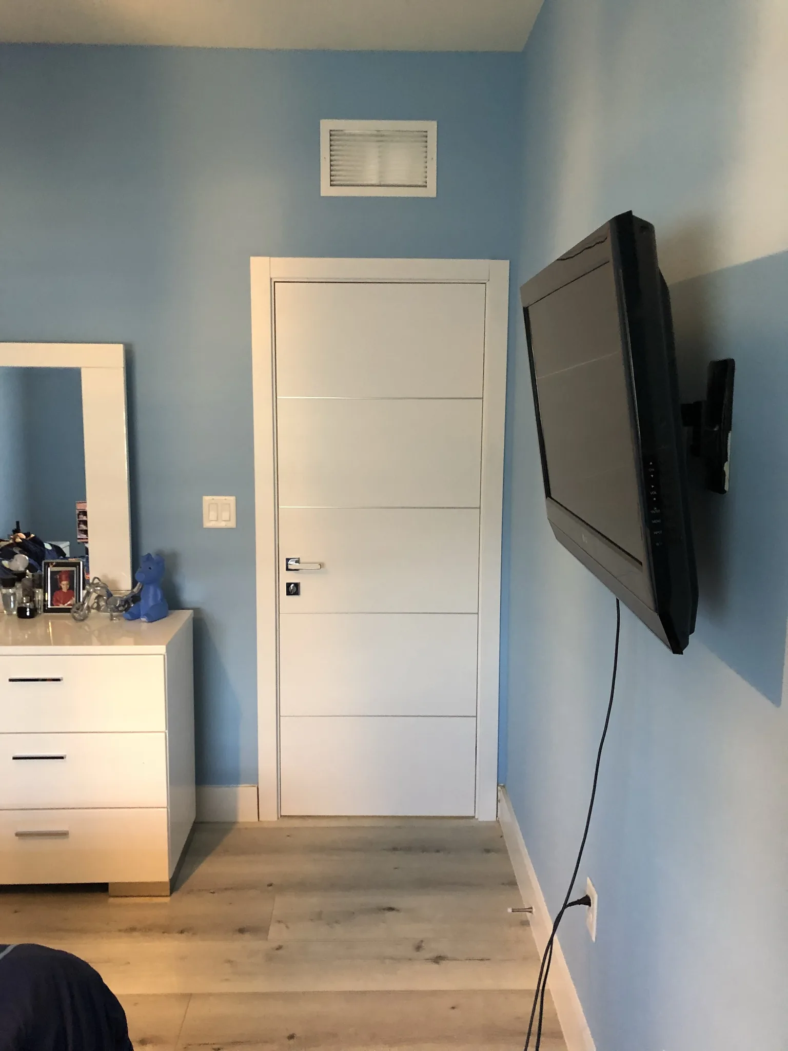 White double doors in a bedroom — interior door supplied and installed by Slab & Trim