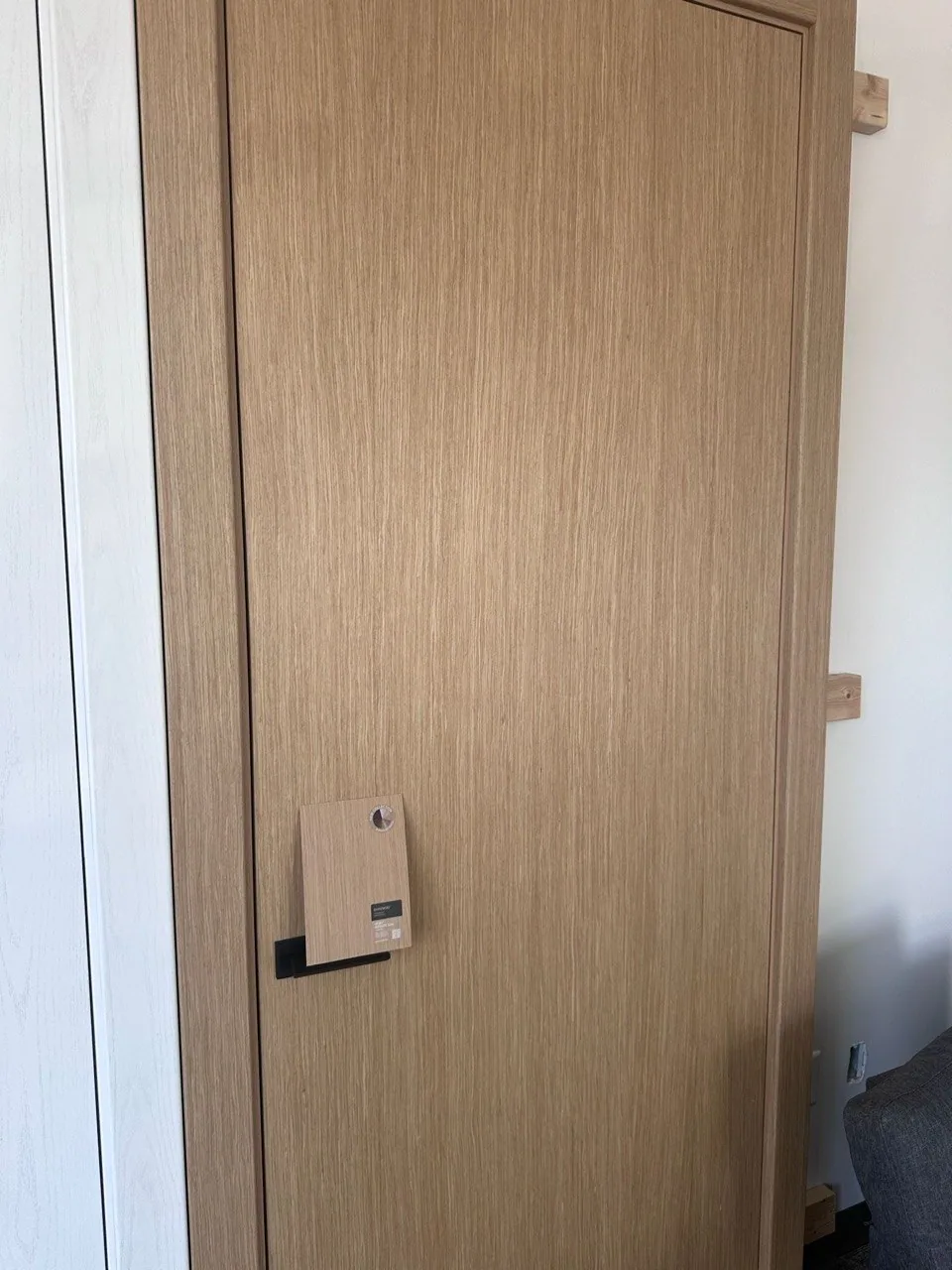 Natural oak wood veneer interior door, close-up of the vertical grain