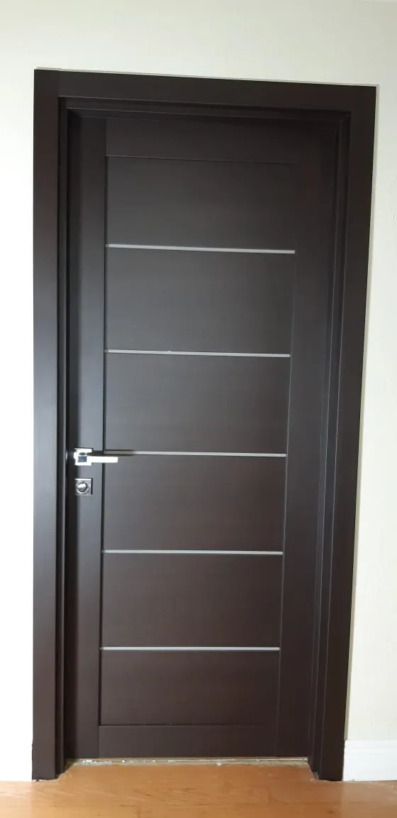 Wenge door with aluminum inlays — interior door supplied and installed by Slab & Trim