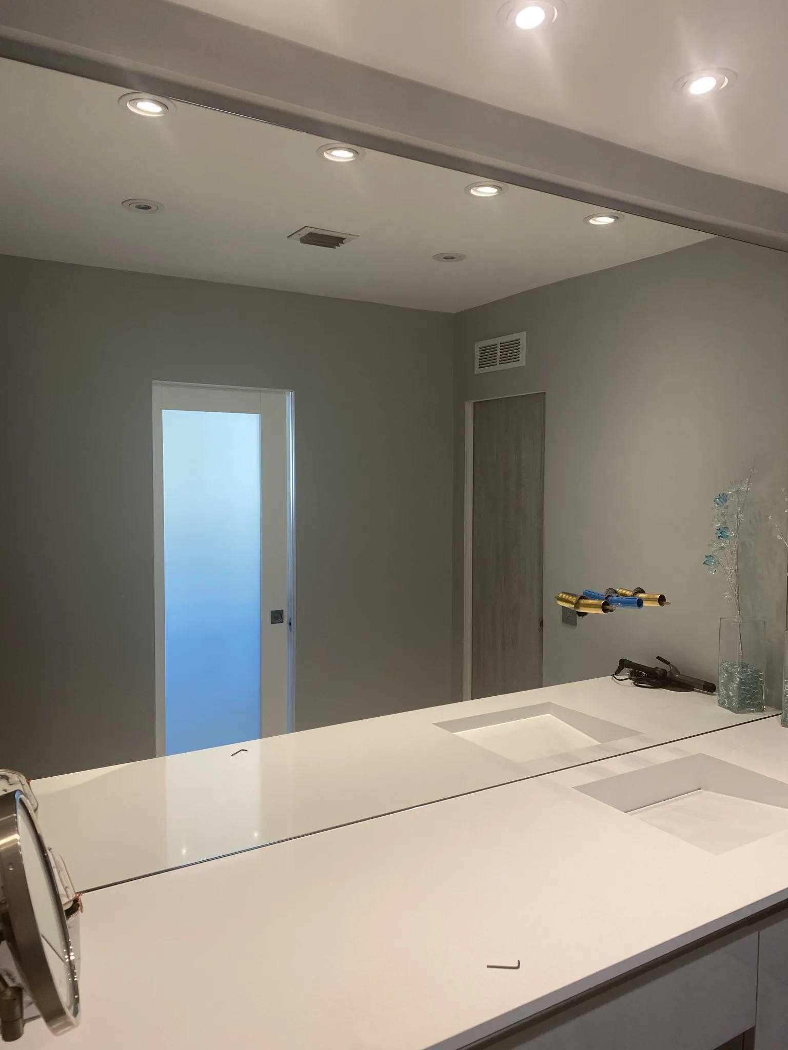 Frosted-glass door with a soft backlight — interior door supplied and installed by Slab & Trim