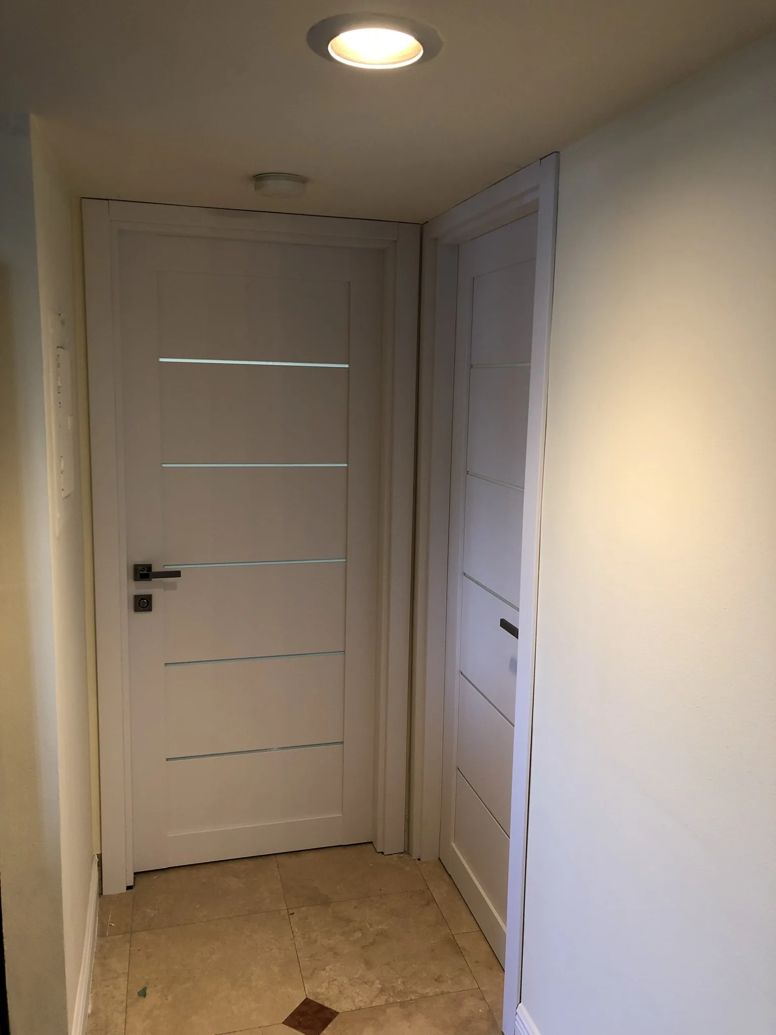 White doors with slim frosted-glass inlays — interior door supplied and installed by Slab & Trim