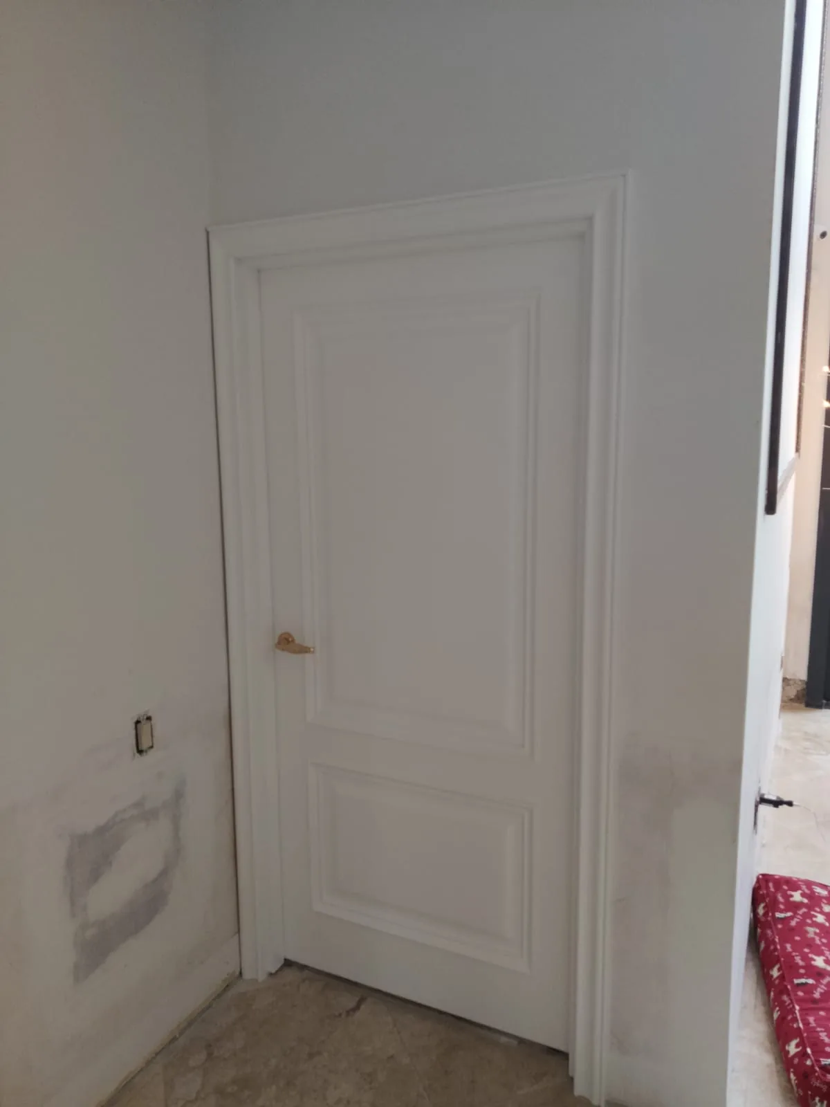 White two-panel shaker-style door — interior door supplied and installed by Slab & Trim
