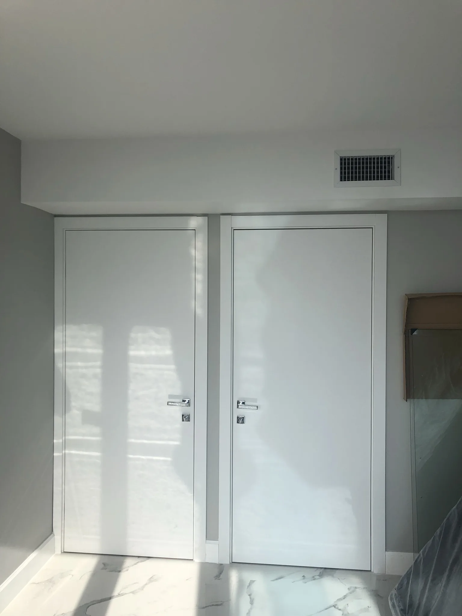 White double doors with slim inlays — interior door supplied and installed by Slab & Trim