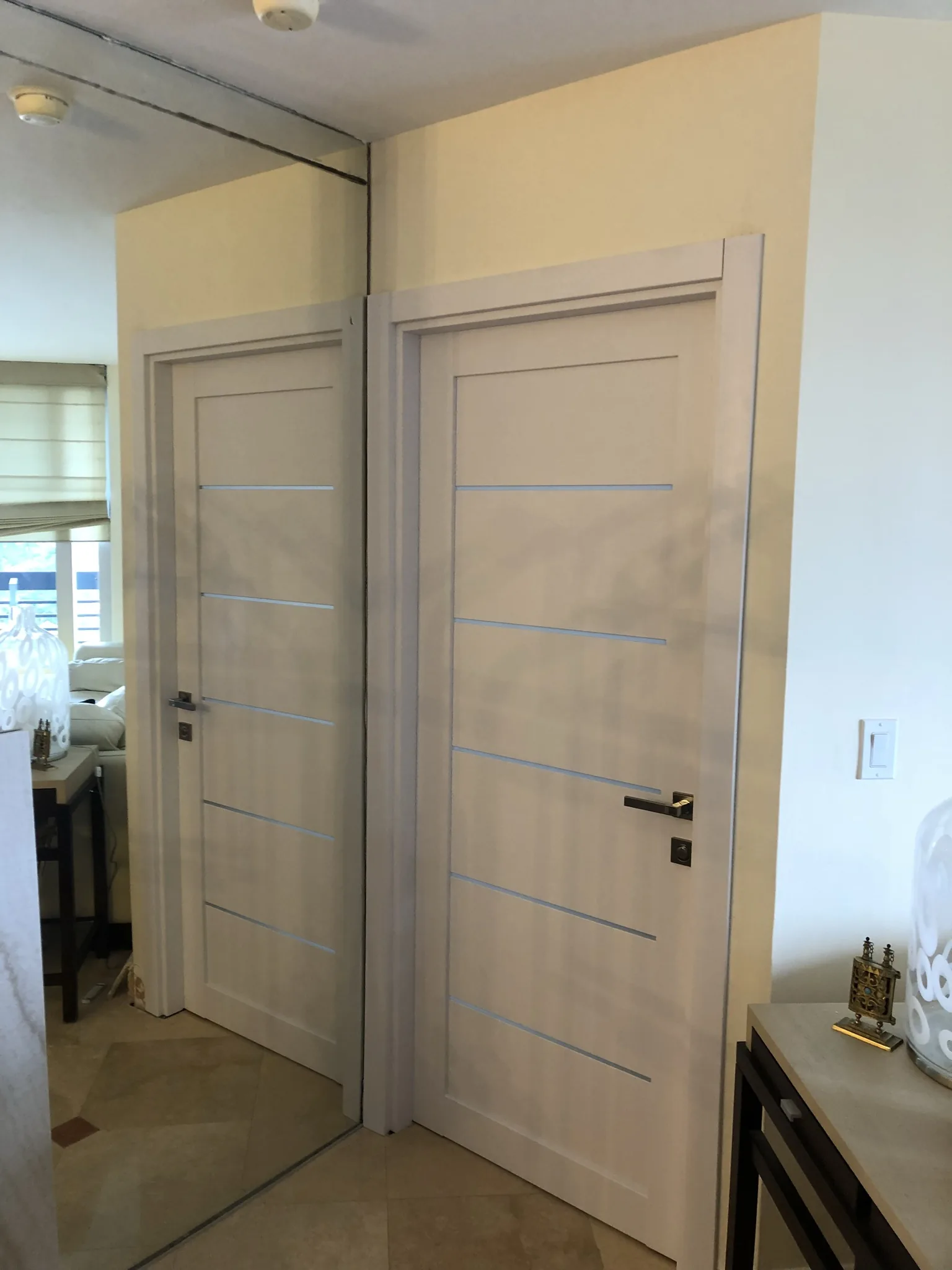 Light grey woodgrain doors with frosted-glass inlays — interior door supplied and installed by Slab & Trim