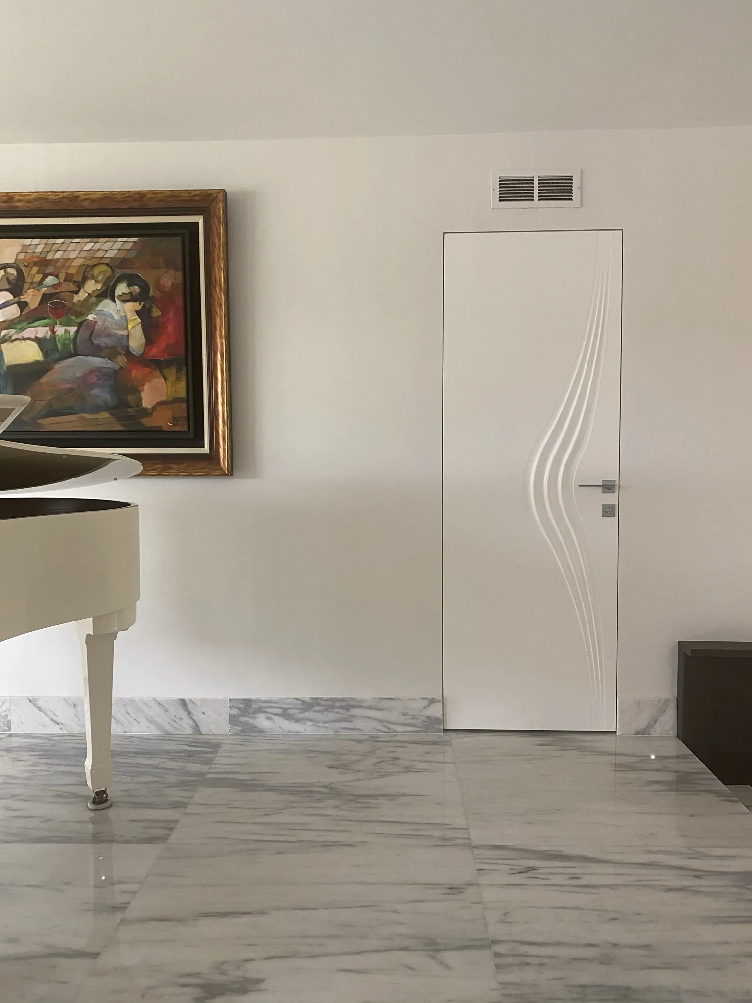 White door with a decorative wave groove — interior door supplied and installed by Slab & Trim