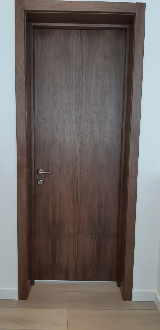 Natural walnut woodgrain door — interior door supplied and installed by Slab & Trim